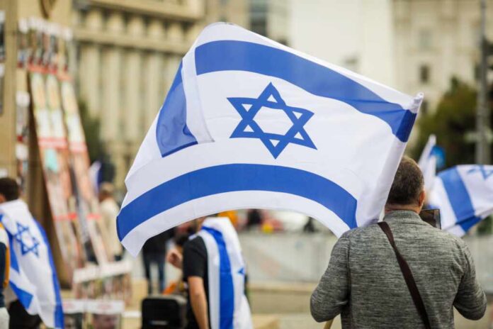 Details,With,A,Man,Holding,An,Israeli,Flag,During,A