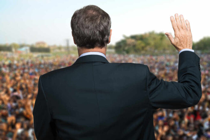 Politician,Talking,And,Making,An,Oath,With,His,Arm,Raised