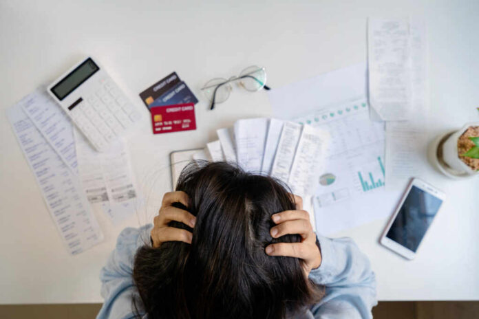 Stressed,Young,Woman,Calculating,Monthly,Home,Expenses,,Taxes,,Bank,Account