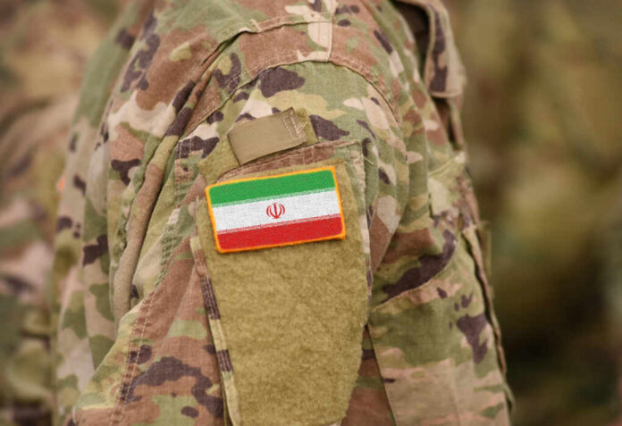 Flag,Of,Iran,On,Soldiers,Arm,(collage).