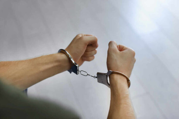 Man,Detained,In,Handcuffs,Indoors,,Closeup,View.,Criminal,Law