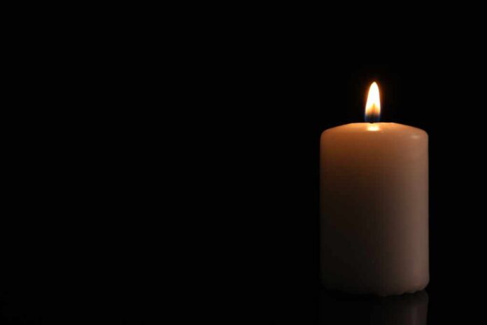 Burning,Candle,On,Dark,Background,,Space,For,Text.,Memory,Day