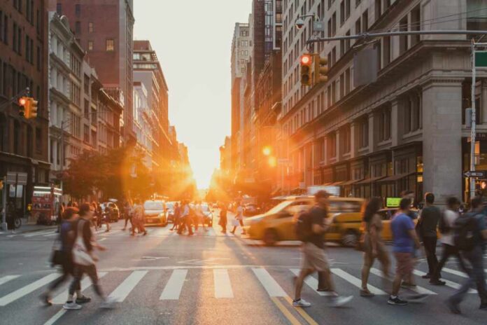 Busy,Intersection,Is,Crowded,With,People,And,Cars,On,5th