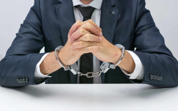 Businessman,With,Handcuffs