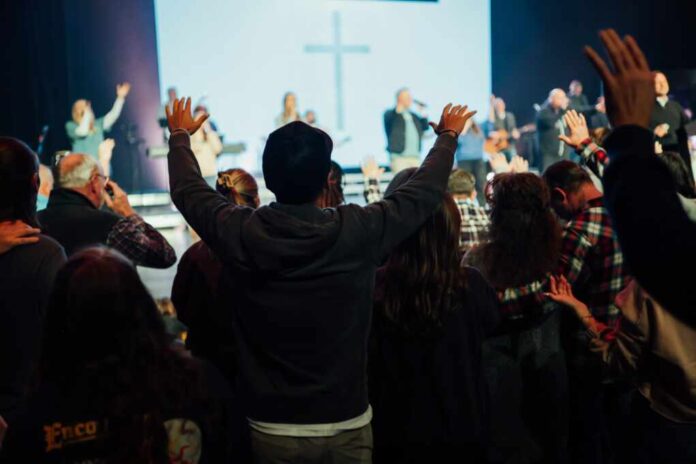 Hands,Raised,During,Church,Worship