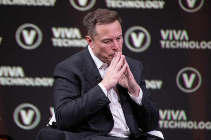 shutterstock_2318800293.jpg A man in a suit with a thoughtful expression at a technology conference