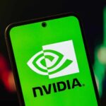 Nvidia’s $68B Shock: AI Bubble Burst NVIDIA logo displayed on a smartphone screen with a green background