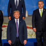 Group of political leaders posing for a photo at an international summit
