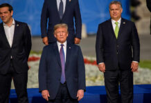 Group of political leaders posing for a photo at an international summit