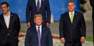 Group of political leaders posing for a photo at an international summit