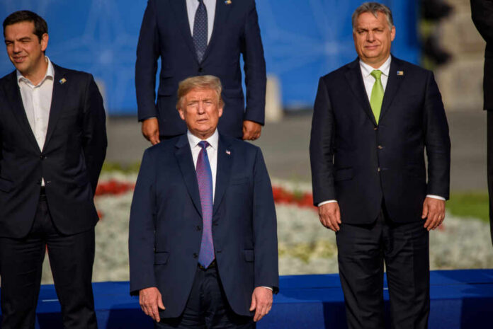Group of political leaders posing for a photo at an international summit
