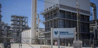 Valero refinery with industrial structures and a fenced area