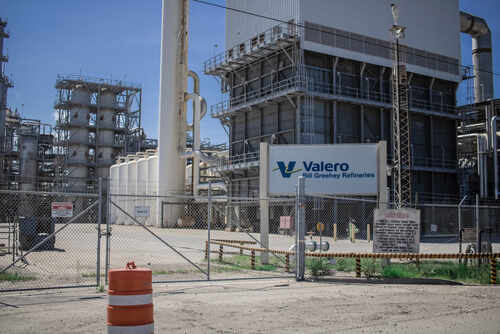 Valero refinery with industrial structures and a fenced area