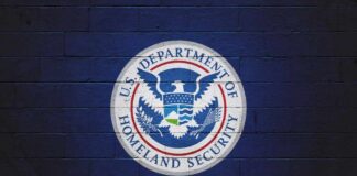 Logo of the U.S. Department of Homeland Security on a blue wall