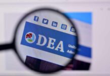 Magnified view of a website header featuring the acronym 'DEA' and social media icons