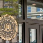 Khamenei Killed—FBI Goes High Alert FBI seal displayed on the exterior of a government building