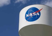 Congress’ Space Spending Spree: What’s the Cost to Taxpayers? NASA logo on a water tower against a blue sky