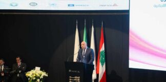 A speaker addressing an audience at a conference in Lebanon