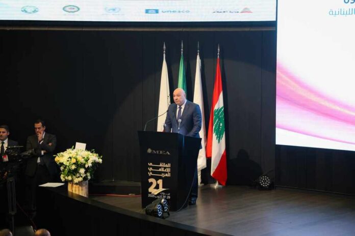 A speaker addressing an audience at a conference in Lebanon