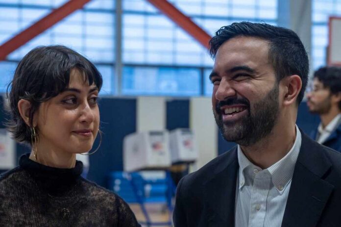Two individuals engaged in conversation at a voting location