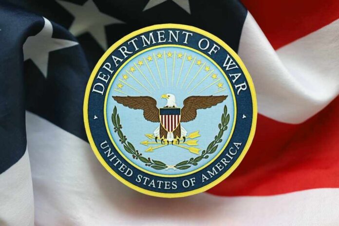 Emblem of the Department of War on a background of the American flag