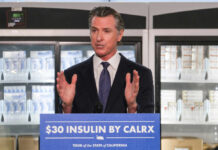 California governor speaking at a press conference about insulin pricing