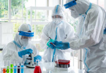 Scientists in protective suits conducting research in a laboratory