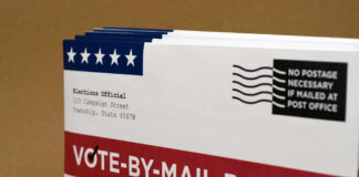 Major Legal Battle Looms Over Trump’s Voting Order Vote-by-mail ballot with election details and postage information