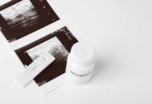 Ultrasound images and a bottle of misoprostol next to a pregnancy test