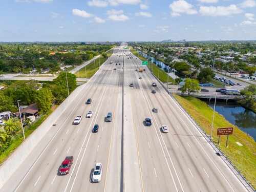 shutterstock_2460705903.jpg Aerial view of a busy highway with multiple lanes and vehicles