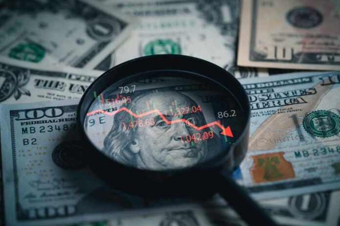 Magnifying glass over US dollar bills with stock market data displayed