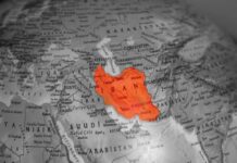Iran’s BOLD Move: Will It Backfire? Map highlighting Iran in orange on a grayscale background