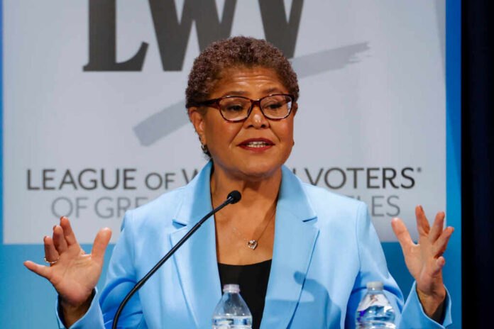 A female politician speaking passionately at a podium during a conference