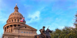 Trump-Loyalist’s $17M GAMBLE Pays Off Big in Texas Statue of a rider in front of the Texas State Capitol building under a blue sky