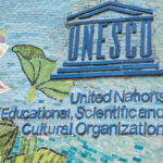 UNESCO sign on a colorful mosaic wall