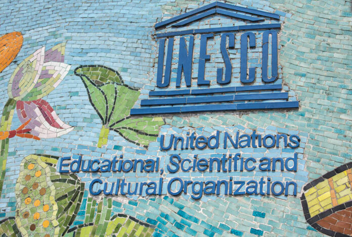 UNESCO sign on a colorful mosaic wall