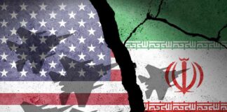 A cracked wall featuring the flags of the USA and Iran with military aircraft silhouettes
