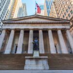 SHOCKING Party Flip — Impeachment Mission Revealed! Historic building with columns and a statue in front, featuring an American flag
