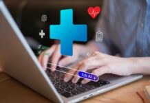 Person typing on a laptop with health-related icons displayed