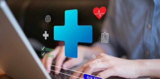 Person typing on a laptop with health-related icons displayed