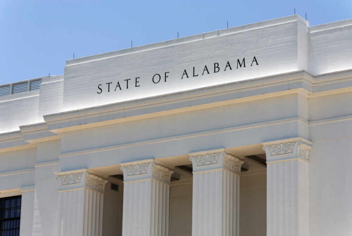 shutterstock_375857752.jpg Facade of a government building with the words 'STATE OF ALABAMA' displayed prominently