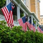 American flags hanging along a historic building porch