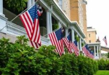 American flags hanging along a historic building porch
