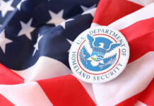 Federal Squeeze Sparks Election War U.S. Department of Homeland Security emblem on an American flag