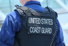 War Powers Gone Wild At Sea Coast Guard officer in uniform with a visible badge