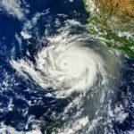 Monster Wave Hammers Hawaii Condos Satellite image of a powerful hurricane over the ocean