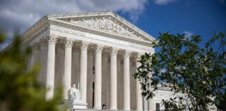 Supreme Court Greenlights Controversial Map The Supreme Court building with columns and a statue in front