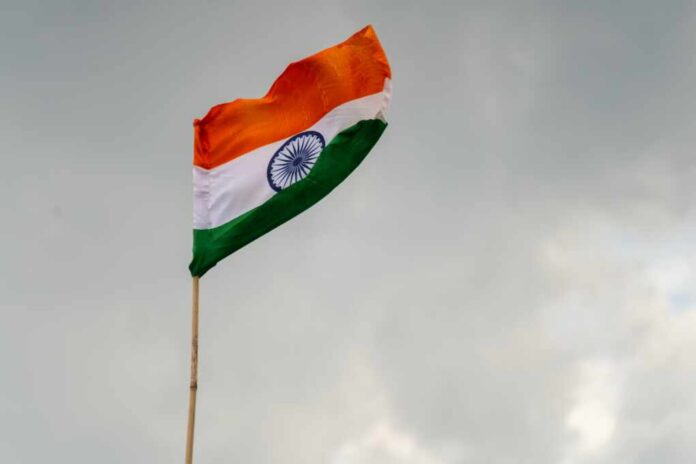 Indian,Tricolor,Flag,Against,Storm,Cloudy,Sky,Showing,National,Pride Indian flag waving against a cloudy sky