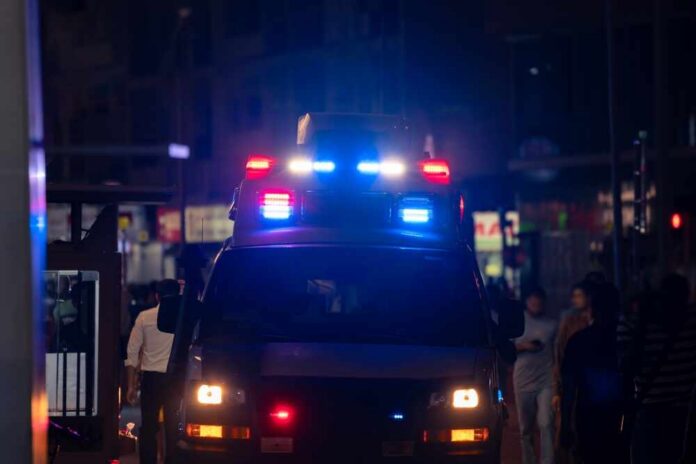 Ambulance,Responding,To,Emergency,Call Emergency vehicle with flashing lights in a busy urban area at night