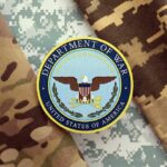 Department of War emblem on camouflage fabric